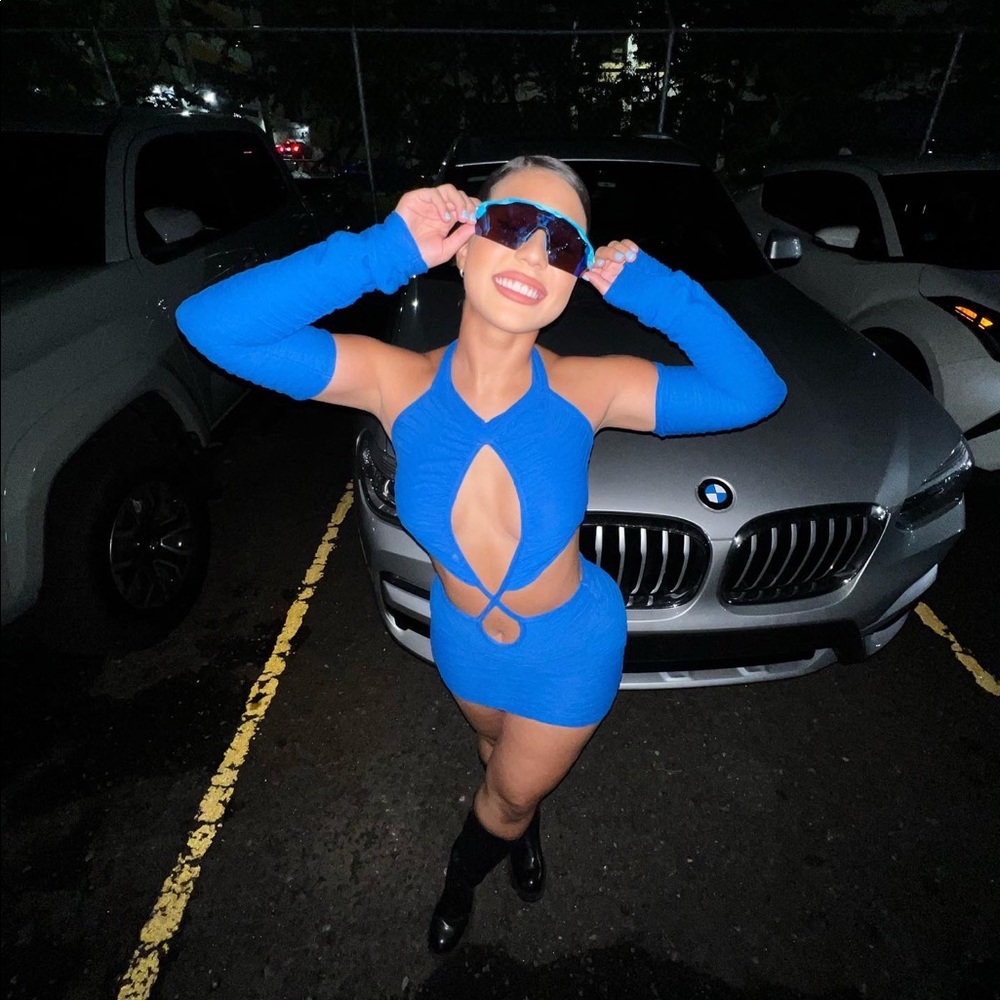 Bright blue pleated jersey tie neck cut out bodysuit and mini skirt